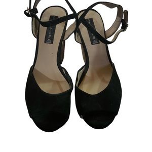 This is a pair of block heeled sandals